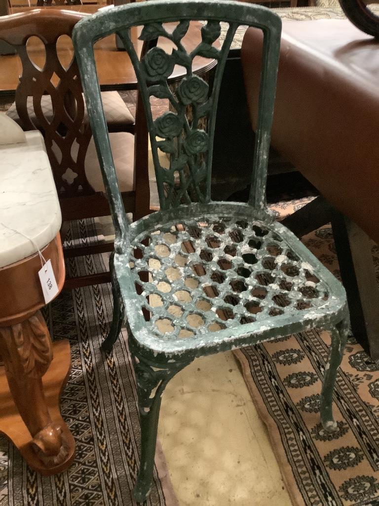 Four cast aluminium chairs, two with arms